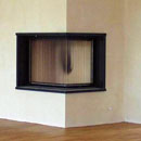 Wandheizung und Eckkamin